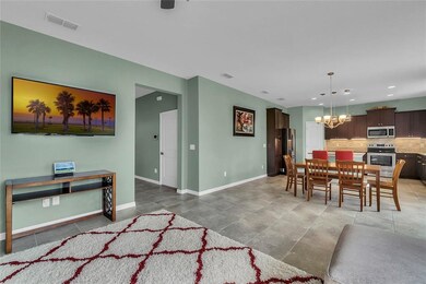 Neutral tone ceramic tile floors run throughout th