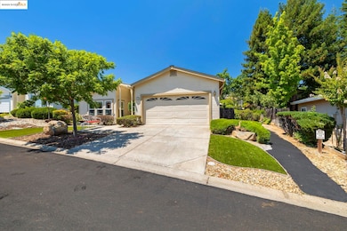 View of front of home featuring driveway and a garage
