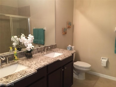 Bathroom featuring tile patterned floors, toilet,