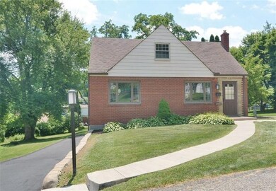 Large front yard.  Long driveway runs along side o
