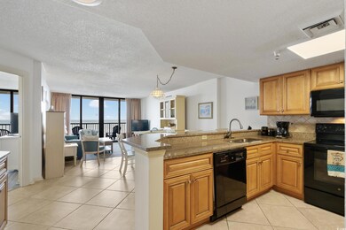 Kitchen featuring sink, expansive windows, kitchen