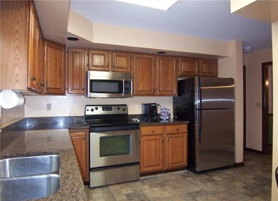 Kitchen has stainless appliances.
