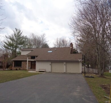 A gracious front yard and a fully-fenced back yard