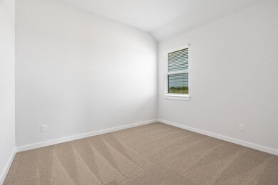 Carpeted empty room featuring baseboards and loft