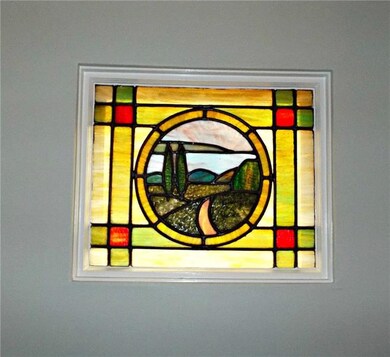 One of 2 stained glass windows in living room on e