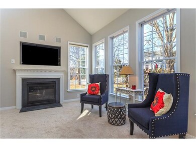 Gather... a well lit family room with built in sur