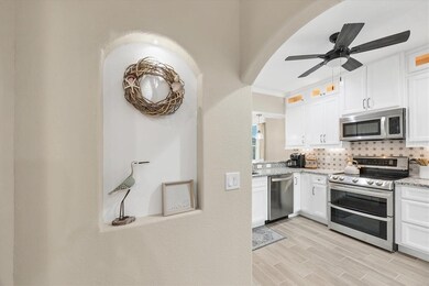 VIEW FROM FOYER TO KITCHEN-PORCELAIN TILE FLOORS THROUGHOUT!