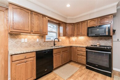 UPDATED CABINETRY, TILE BACK SPLASH WITH ACCENT LI