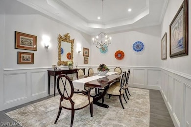 Dining/flex room with custom wainscoting walls.