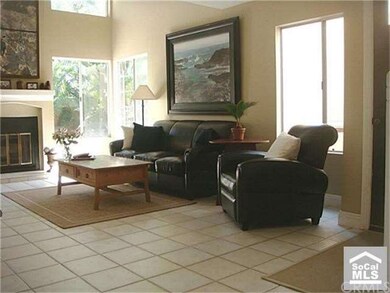 Another view of living room and more windows