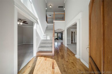 Hickory wood floors with iron and oak staircase