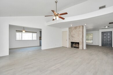 The family room has a wonderful ledge that is perfect for displaying art or other collectibles.