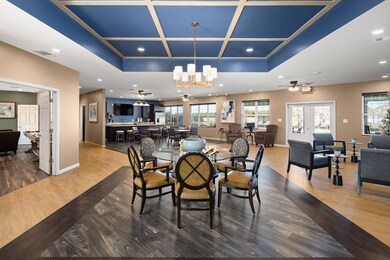 Dining space with coffered ceiling, hardwood / woo