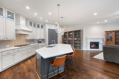 The open-concept design connects the kitchen and family room, offering a bright, spacious flow.