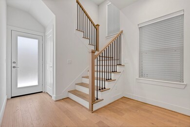 Hallway leading to stairs to 2nd floor and back ya