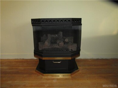 Other. Living room features a ventless gas stove.
