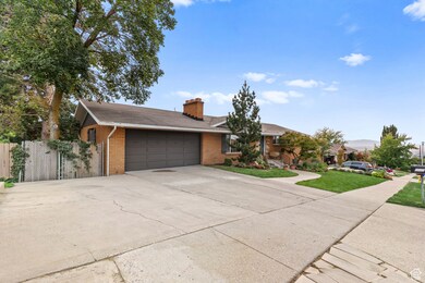 Ranch-style house featuring brick siding, a chimney, concrete driveway, a shingled roof, and a garage