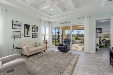 Living room with beam ceiling, ceiling fan, crown