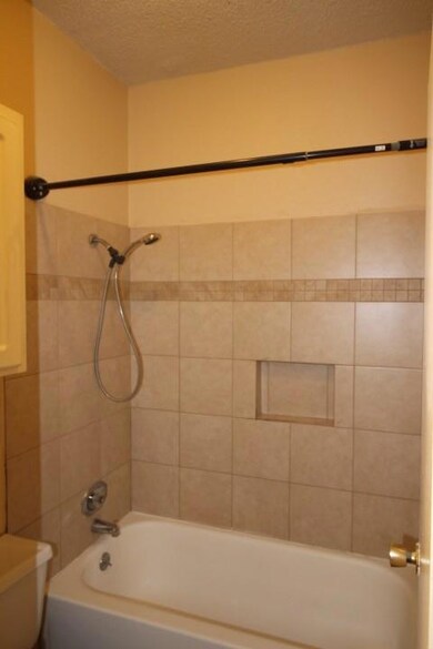 Bathroom with toilet, shower / tub combination, a
