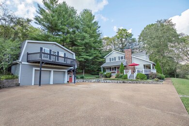 This home features a two-car heated and cooled, detached garage with full workbench and pegboard walls ready for all your tools and projects. 