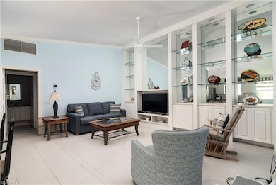 Living room with light tile patterned floors, crow