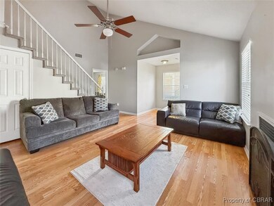 Living room featuring visible vents, baseboards, s