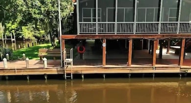 Use your private canal access, boat slip(s) and launch to the left of the property.