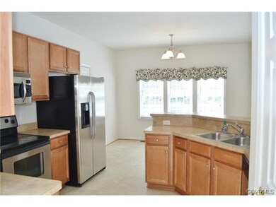 Open to the breakfast room and family room