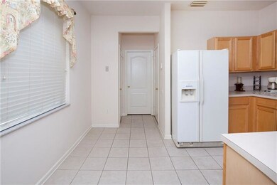 Kitchen has enough space for breakfast table.