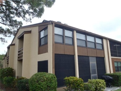 BACK OF UNIT LANAI WITH WINDOWS AND WALL