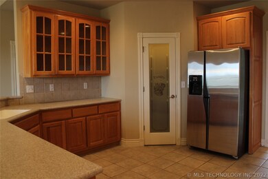 Large kitchen with corian counters, walk-in pantry
