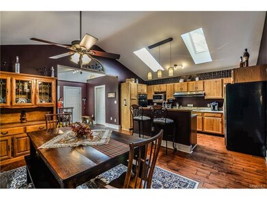 Vaulted Kitchen with lovely cabinets and eat in ar