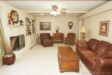 Den with open access to kitchen. Built in bookcase