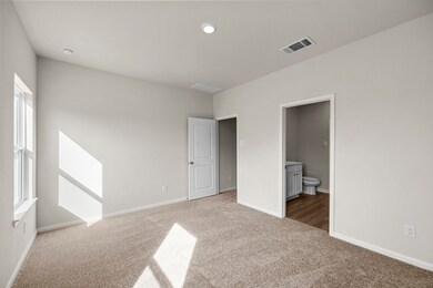 The primary bedroom is the perfect place to relax