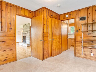 Beyond your living room is a bedroom which could serve well as an office.