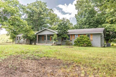 Single story home featuring a front yard