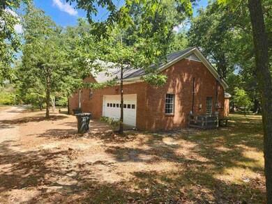 View of property exterior featuring a garage