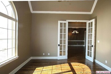 French doors open to the large home office with gr