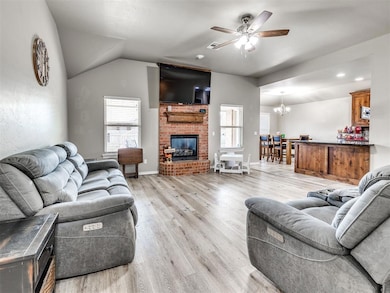 Living room featuring light neutral LVP floors, ce