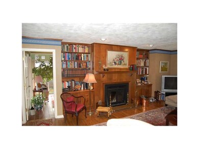 Family Room. The wood-burning fireplace in the Fam
