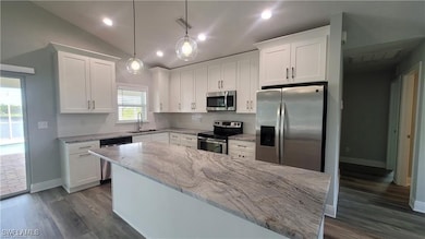 Kitchen featuring appliances with stainless steel