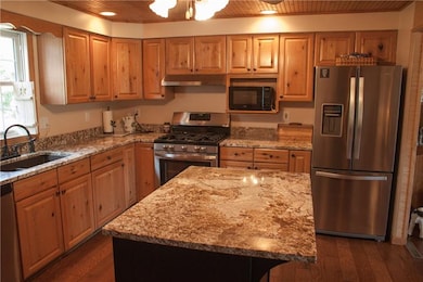 Beautiful oak cabinetry and granite countertops