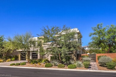 Desert landscaping complements this modern home