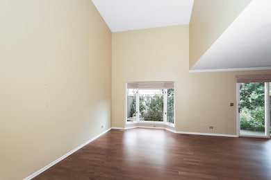 Valulted ceilings and bay window overlooks the bac