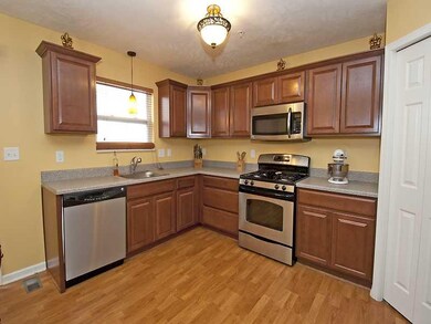 Kitchen. Upgraded cabinets, stylish lighting, warm