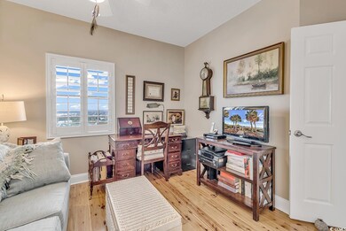 Interior space with ceiling fan and light hardwood