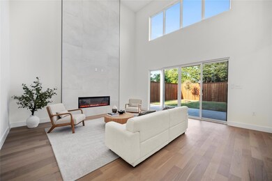 Living room featuring a tile fireplace and wood-ty