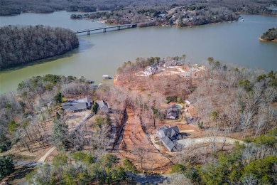Birds eye view of property featuring a view of tre