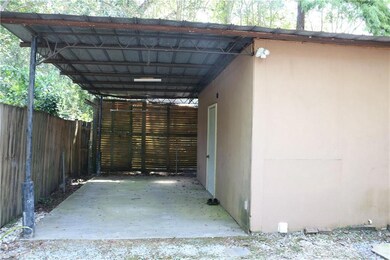 Upper unit carport with attached laundry/storage r