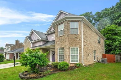 View of front facade featuring brick siding and ce